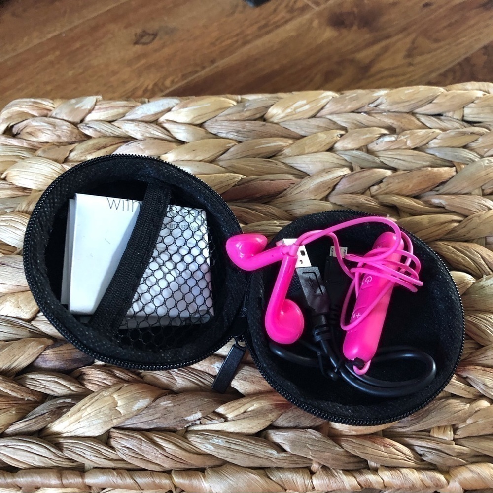 Hot pink wireless earbud with case